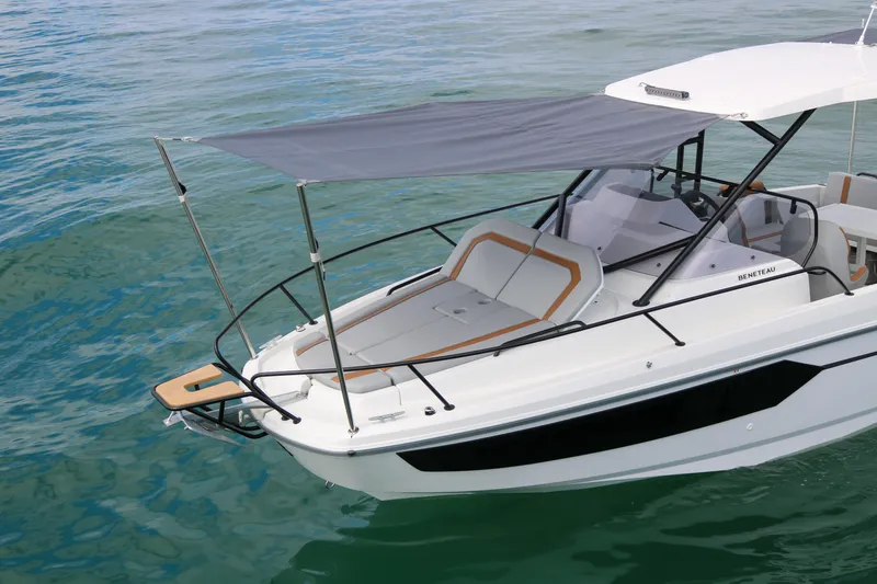 Slide: The Image of 2023 Beneteau Flyer 8 SUNdeck boat on water, featuring a sleek design and sunshade. - 15