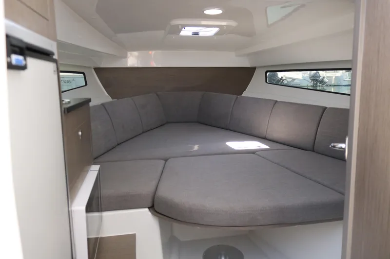 Slide: The Image of 2023 Beneteau Flyer 8 SUNdeck cabin interior with modern seating and natural light. - 5