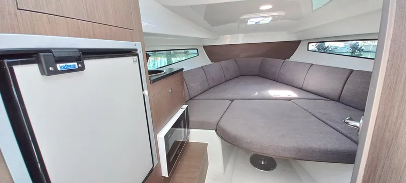 Slide: The Image of 2023 Beneteau Flyer 8 SUNdeck interior with cozy seating and modern amenities. - 7