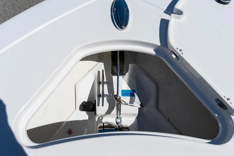 Slide: The Image of Anchor compartment of 2026 Sportsman Open 282 Center Console boat, showcasing storage design. - 10