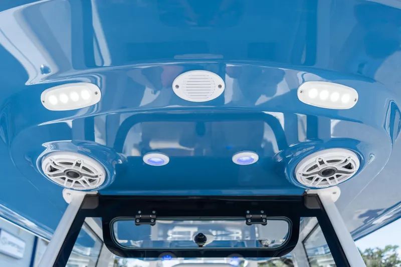 Slide: The Image of 2026 Sportsman Open 282 Center Console boat interior with speakers and LED lights. - 13