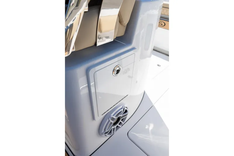Slide: The Image of 2026 Sportsman Open 282 Center Console boat interior detail with speaker and storage compartment. - 16