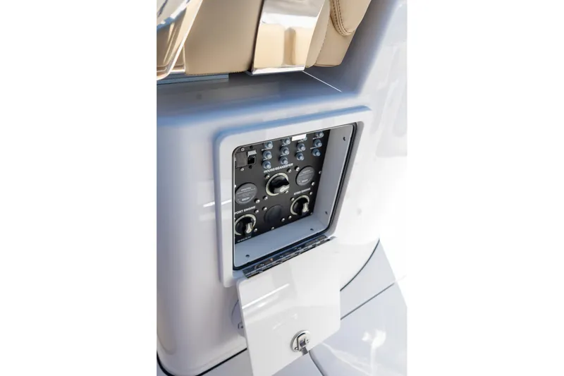 Slide: The Image of 2026 Sportsman Open 282 Center Console control panel with switches and dials. - 17