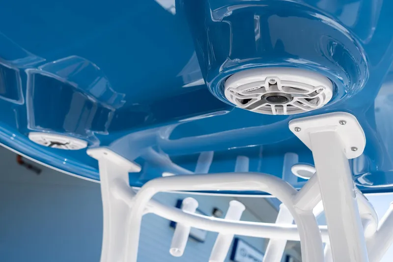 Slide: The Image of 2026 Sportsman Open 282 Center Console, blue hull with white speaker and support structure. - 18