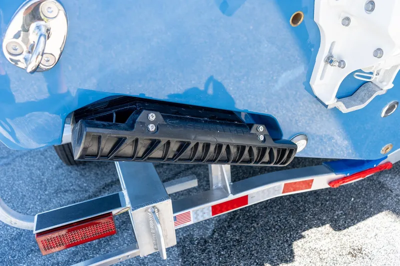 Slide: The Image of 2026 Sportsman Open 282 Center Console boat on trailer, close-up of hull and hardware. - 20