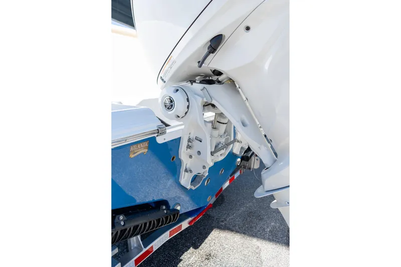 Slide: The Image of 2026 Sportsman Open 282 Center Console boat engine detail on trailer. - 21