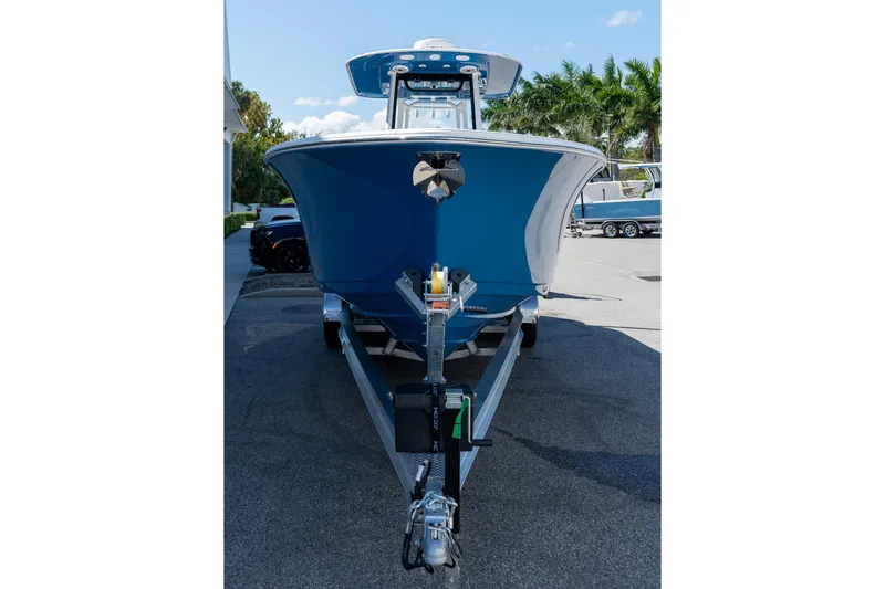 Slide: The Image of 2026 Sportsman Open 282 Center Console boat on trailer, parked outdoors. - 23