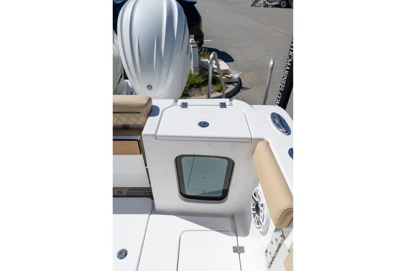 Slide: The Image of 2026 Sportsman Open 282 Center Console boat interior with seating and storage compartment. - 32
