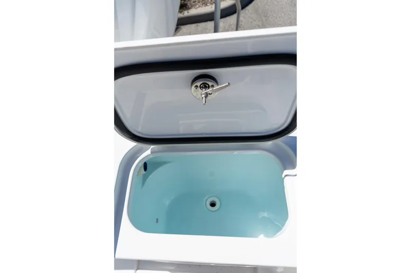 Slide: The Image of Open storage compartment on 2026 Sportsman Open 282 Center Console boat. - 33