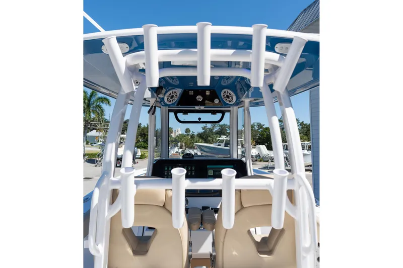 Slide: The Image of 2026 Sportsman Open 282 Center Console boat interior with rod holders and navigation equipment. - 41