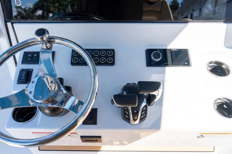 Slide: The Image of 2026 Sportsman Open 282 Center Console dashboard with steering wheel and controls. - 46