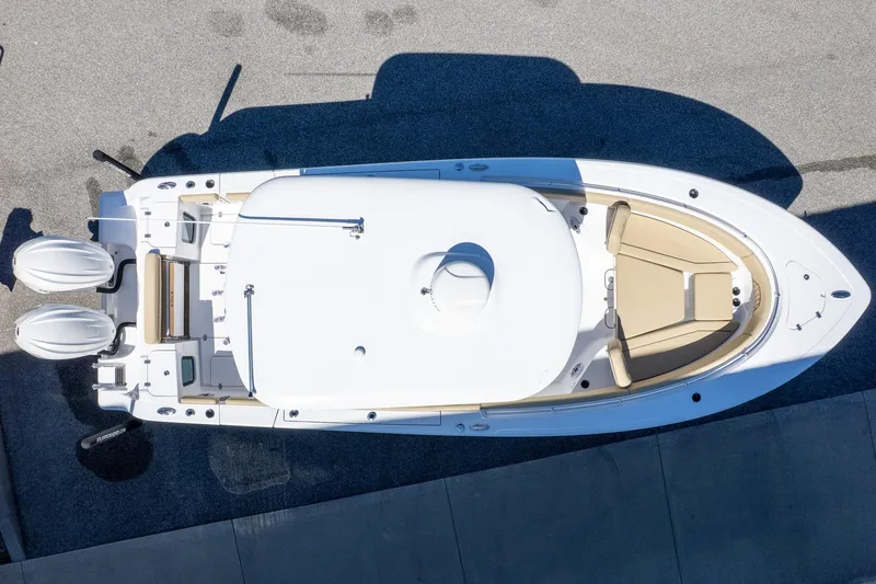 Slide: The Image of 2026 Sportsman Open 282 Center Console boat, aerial view, dual engines, sleek design. - 6