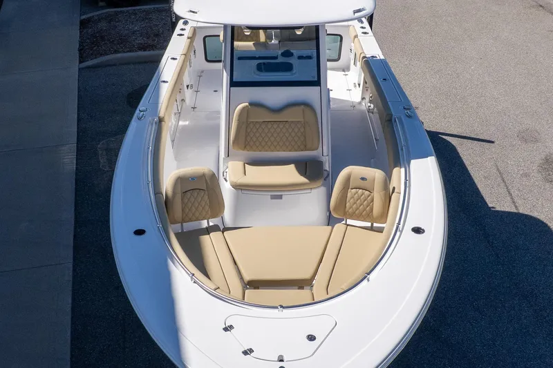 Slide: The Image of 2026 Sportsman Open 282 Center Console boat with tan seating and spacious deck. - 7