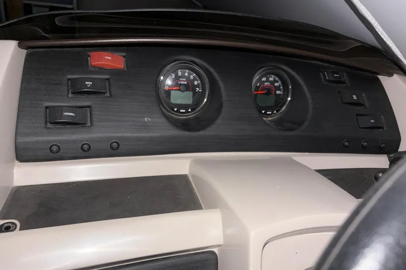 Slide: The Image of Dashboard of 2019 Bennington SX 22 Fishing boat with gauges and switches. - 17