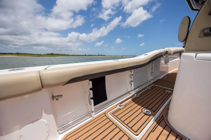 Slide: The Image of 2020 Tidewater 320 CC Adventure boat deck with scenic water view. - 28