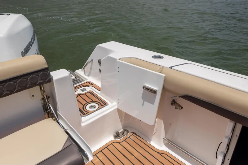 Slide: The Image of 2020 Tidewater 320 CC Adventure boat deck with seating and water view. - 29