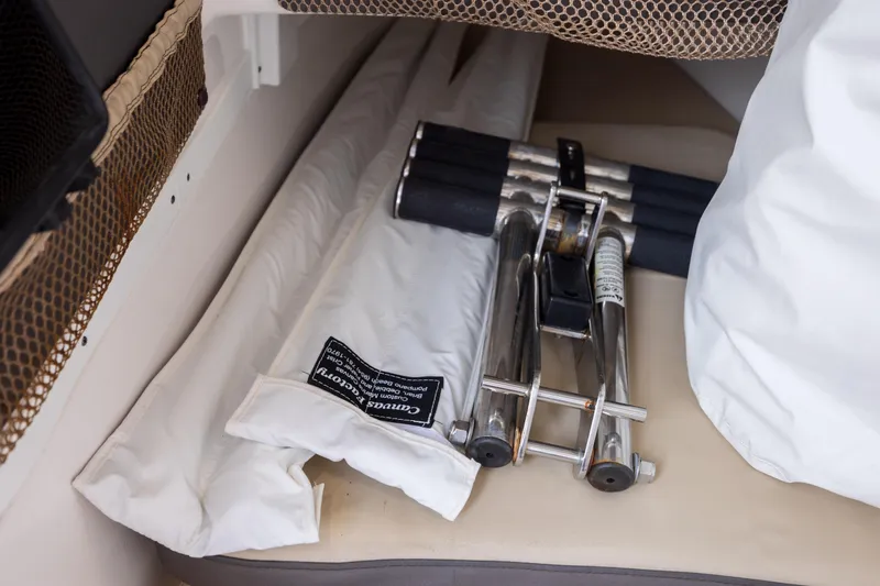 Slide: The Image of Storage area in 2020 Tidewater 320 CC Adventure boat with folded equipment and netting. - 39