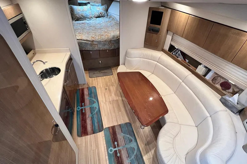 Slide: The Image of Luxurious interior of 2011 Formula 37 Performance Cruiser with cozy seating and kitchenette. - 17
