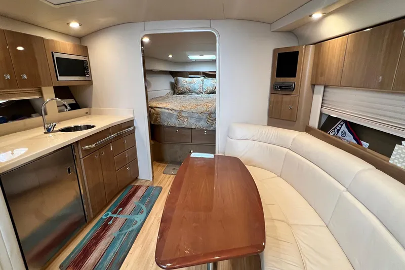 Slide: The Image of Luxurious interior of a 2011 Formula 37 Performance Cruiser with kitchen and seating area. - 20