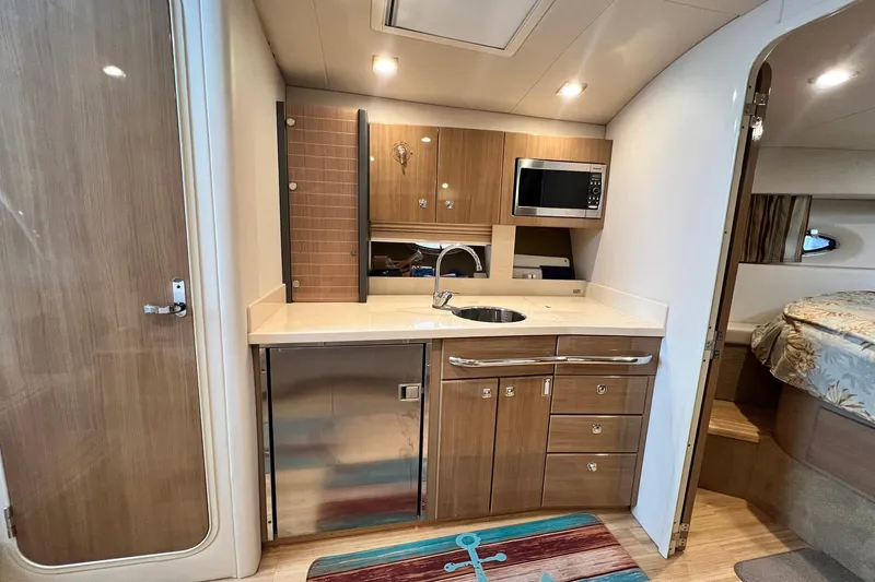 Slide: The Image of Interior of 2011 Formula 37 Performance Cruiser with kitchenette and modern amenities. - 21