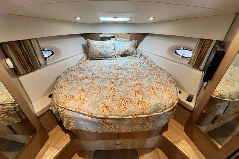 Slide: The Image of 2011 Formula 37 Performance Cruiser cabin with cozy bed and elegant decor. - 23