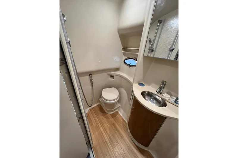 Slide: The Image of Bathroom interior of 2011 Formula 37 Performance Cruiser with modern fixtures and wood flooring. - 29