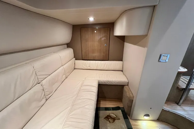 Slide: The Image of Interior of 2011 Formula 37 Performance Cruiser with beige seating and wooden accents. - 31