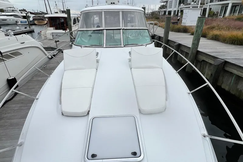Slide: The Image of 2011 Formula 37 Performance Cruiser docked with white deck seating. - 34