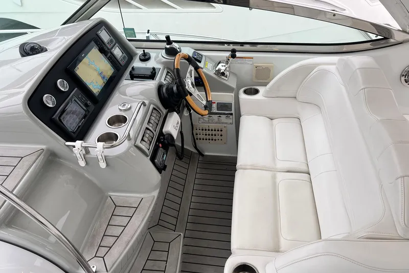 Slide: The Image of 2011 Formula 37 Performance Cruiser cockpit with modern navigation system and luxurious white seating. - 5