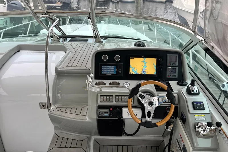 Slide: The Image of Cockpit of 2011 Formula 37 Performance Cruiser with navigation system and wooden steering wheel. - 6