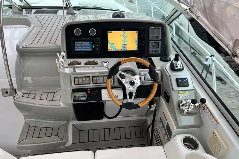 Slide: The Image of Cockpit of 2011 Formula 37 Performance Cruiser with navigation system and wooden steering wheel. - 7