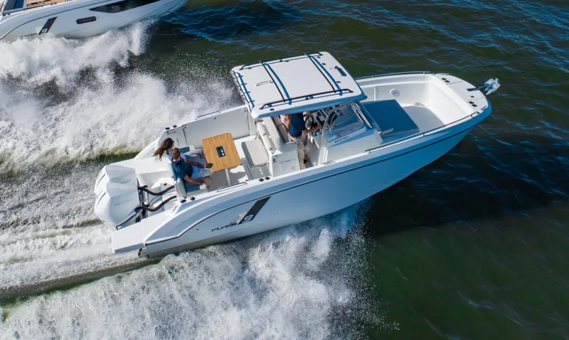 Slide: The Image of 2025 Beneteau Flyer 9 SPACEdeck cruising on open water, showcasing sleek design and performance. - 2