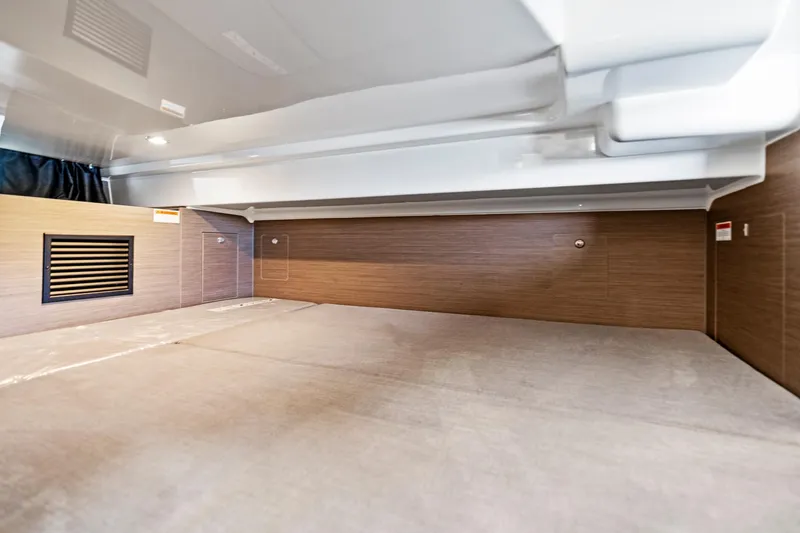 Slide: The Image of 2025 Beneteau Flyer 9 SUNdeck interior cabin with modern wood paneling. - 14