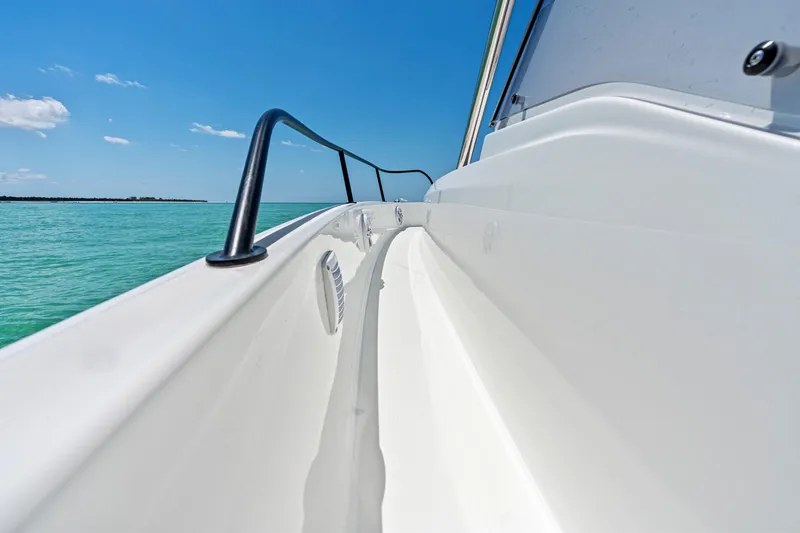 Slide: The Image of 2025 Beneteau Flyer 9 SUNdeck, sleek white deck, ocean view, clear blue sky. - 20