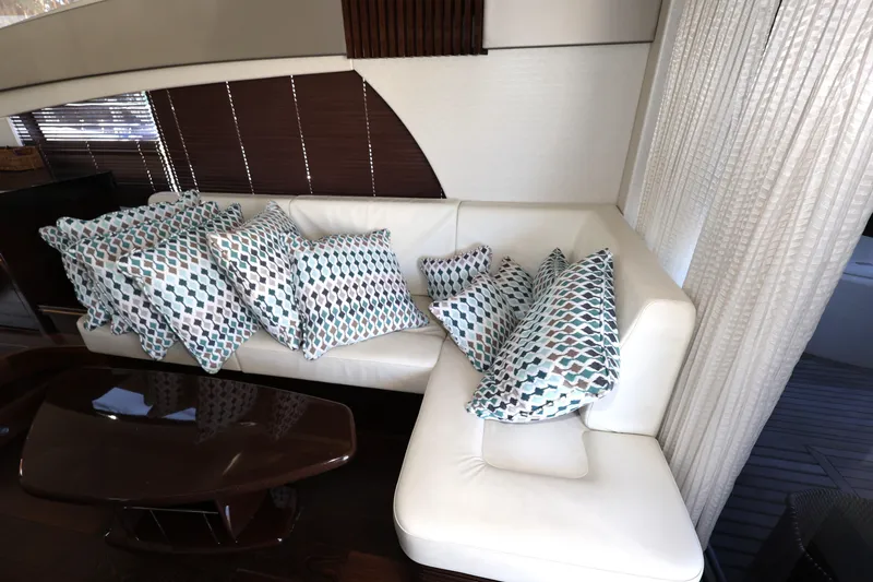Slide: The Image of Luxurious interior of 2016 Sunseeker Manhattan 55 yacht with patterned cushions on white sofa. - 10