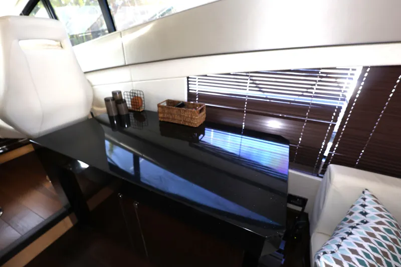Slide: The Image of Luxurious interior of 2016 Sunseeker Manhattan 55 yacht with sleek black table and modern decor. - 12