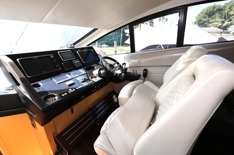Slide: The Image of Interior helm of 2016 Sunseeker Manhattan 55 yacht with luxurious seating and modern controls. - 14