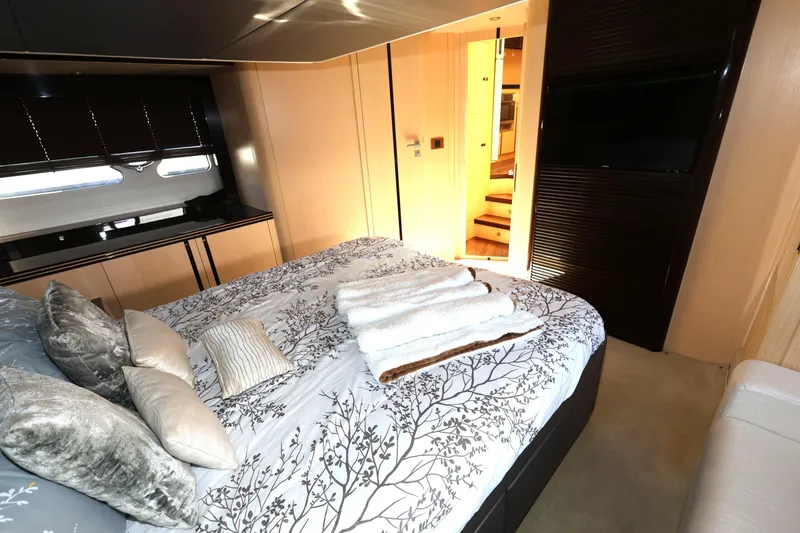 Slide: The Image of Luxurious bedroom interior of 2016 Sunseeker Manhattan 55 yacht with elegant bedding and modern decor. - 27