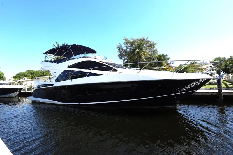 Slide: The Image of 2016 Sunseeker Manhattan 55 yacht docked, featuring sleek design and luxurious amenities. - 3
