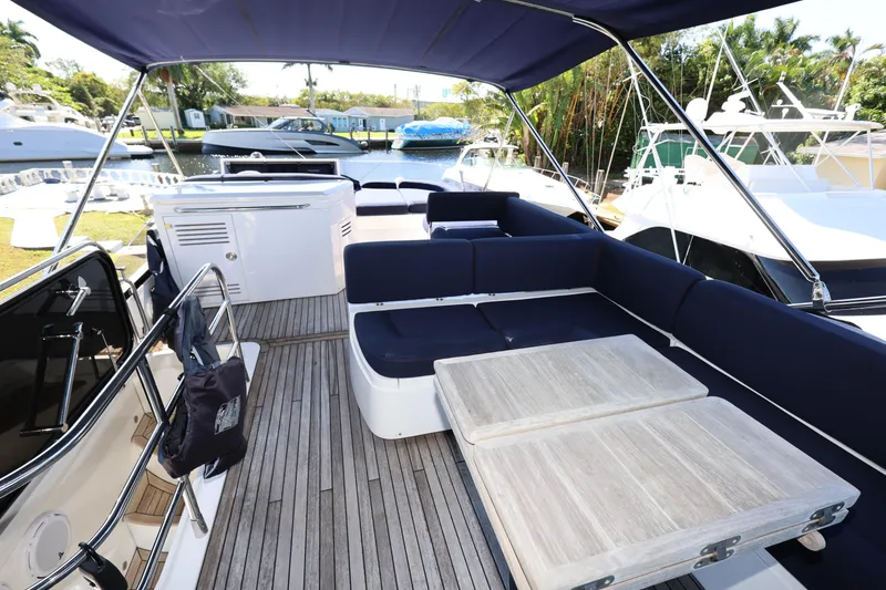 Slide: The Image of Sunseeker Manhattan 55 yacht deck with seating and tables, 2016 model. - 33