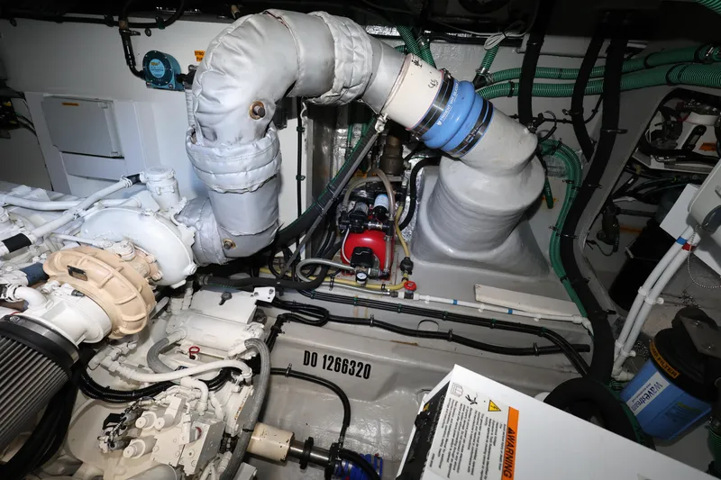 Slide: The Image of Engine room of 2016 Sunseeker Manhattan 55 yacht, showcasing mechanical components and piping. - 40