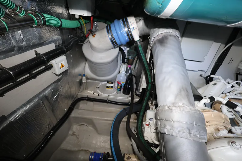Slide: The Image of Engine room of 2016 Sunseeker Manhattan 55 yacht with visible pipes and machinery. - 41