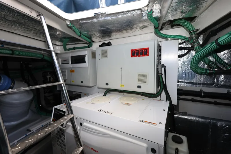 Slide: The Image of Engine room of 2016 Sunseeker Manhattan 55 yacht with Cummins Onan generator and control panels. - 42