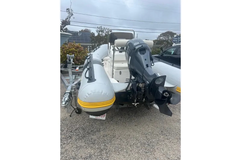 Slide: The Image of 2018 North Atlantic Inflatables RIB420 boat console with steering wheel and controls. - 3