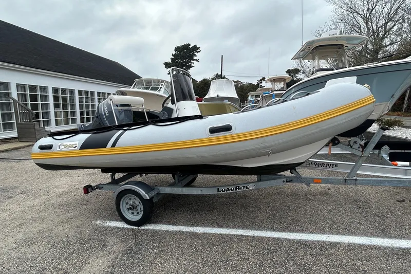 Slide: The Image of 2018 North Atlantic Inflatables RIB420 boat with steering console and Garmin equipment. - 5