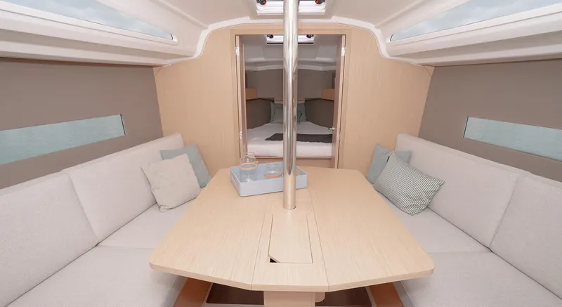 Slide: The Image of Interior of 2025 Beneteau Oceanis 30.1 yacht, featuring cozy seating and modern design. - 12
