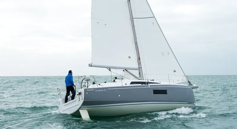 Slide: The Image of 2025 Beneteau Oceanis 30.1 sailing on open water, featuring sleek design and modern sails. - 4