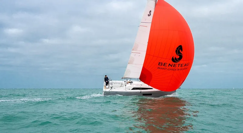 Slide: The Image of 2025 Beneteau Oceanis 30.1 sailing with vibrant red sail on open sea. - 8