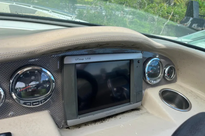 Slide: The Image of Dashboard of a 2014 Regal 3200 Bowrider with Garmin GPS and gauges. - 16