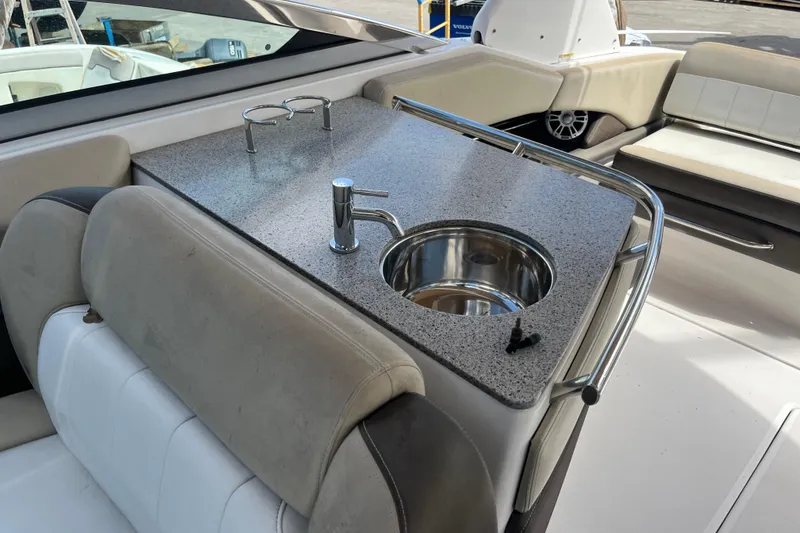Slide: The Image of 2014 Regal 3200 Bowrider boat interior with sink and countertop. - 22